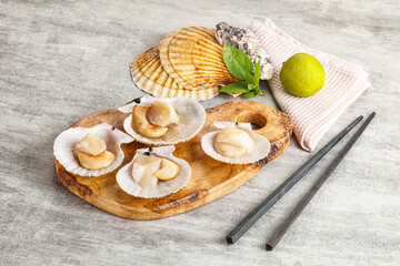 Raw natural scallop in its shell