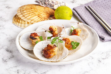 Grilled scallops shell with butter