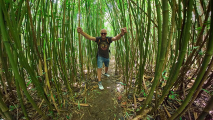 A man experience a pure adventure at the bamboo forest in Hawaii Oahu island