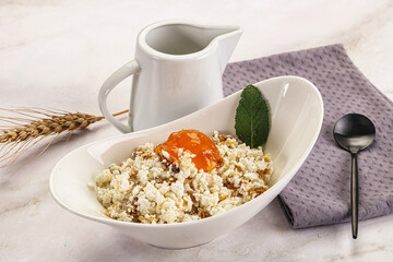 Curd with granola and orange jam