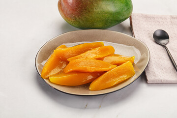 Canned mango slices in the bowl