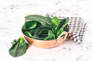 Ripe green spinach leaves heap