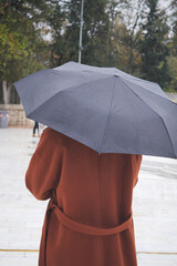 women under umbrella in the rain 