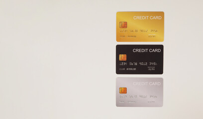 Three credit cards on white background.