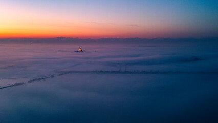 The golden island. Grado Island from above at sunset.