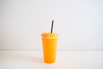 Orange smoothie, juice and fruit orange in plastic cup