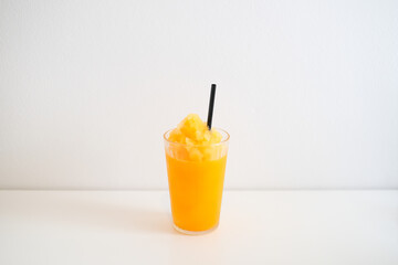 Orange smoothie, juice and fruit orange in glass.