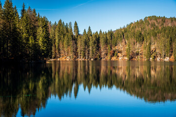 Morning in the Fusine lakes valley. Autumn reflections.