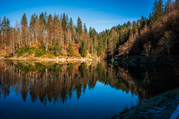 Morning in the Fusine lakes valley. Autumn reflections.