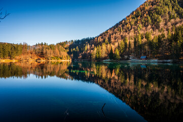 Morning in the Fusine lakes valley. Autumn reflections.