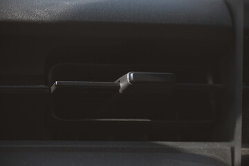 interior view of car with black leather, closeup car air conditional vents