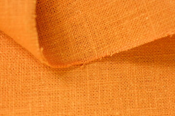 orange hemp viscose natural fabric cloth color, sackcloth rough texture of textile fashion abstract background