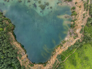 Aerial drone photo of Quarry  turquiose lake colour, open pit mining in Park Grodek, Jaworzno. Poland. Turquiose Water and Wooden Bridge. Polish Maldives Park Grodek in Jaworzno.