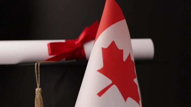 Canadian education and language learning, graduation cap with diploma and flag of Canada, celebrate international study and knowledge