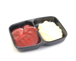 Tomato sauce in a small bowl on a white background