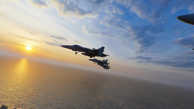Fighter jet flies over aircraft carrier sailing over sea