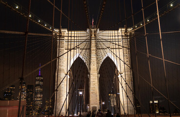 Fototapeta premium Brooklyn suspension bridge view at night with lights - USA tourism them