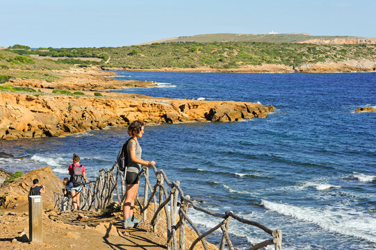 Ramblers on the Cami de Cavalls, hiking trail GR 223, near Punta Negra on the North Coast, Menorca, Balearic Islands, Spain, Mediterranean, Europe