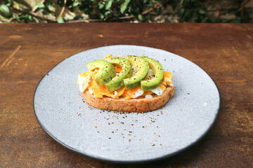bread with egg and avocado topping