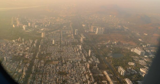 Dakc lake, Koperkhairne, Kopar Khairane, Navi Mumbai, Maharashtra, India. Mumbai Metropolitan Region. Aerial View From Airplane Window On View of the Mumbai suburb district. Evening morning sunset