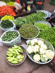 Fresh colorful vegetables in Indian street grocery market.