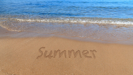 Summer word on sandy beach with blue waves of sea or ocean water. Beach background.