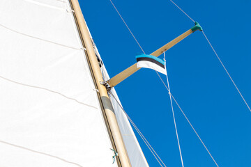 Fototapeta premium Estonian flag on yacht on a shroud under spreader. White and blue. Sailing rules.