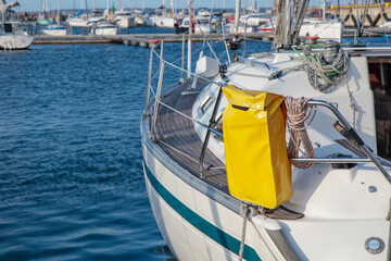 Rescue Sling on a sailboat, yacht in the marine. Boat launch checklist, yellow sling, safety, MOB,...