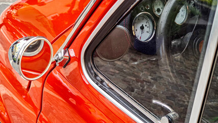 Vintage Red Car Detail - Side Mirror and Dashboard Close-Up