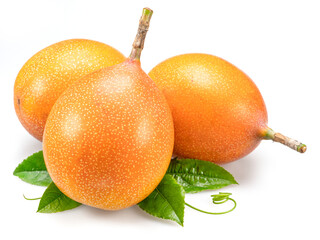Granadilla fruits with leaves close up. The sweetest passiflora fruit or passionfruit.