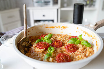 Homemade delicious tomato risotto in a skillet. Delicious italian rice dish