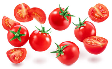Red cherry tomatoes and tomato slices levitating in air isolated on white background.