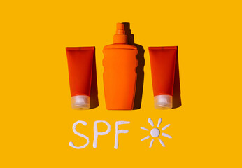 Sunscreen SPF cream on yellow background