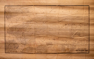 A Vintage historically important map of New York City on grunge paper with black drawing of city streets