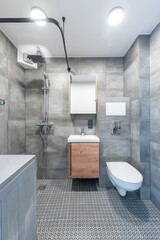 Bright Elegant Modern Minimalist Bathroom Interior Design of Shower Room With White Sink. Bathroom Accessories, Gray Tile Walls, Mirror, Faucet. LED Light.