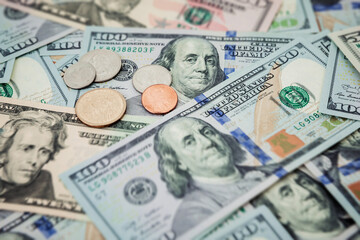 Money background of US dollar banknotes and coins. Close up view