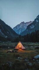 Illuminated Tent in Mountain Valley at Dusk
