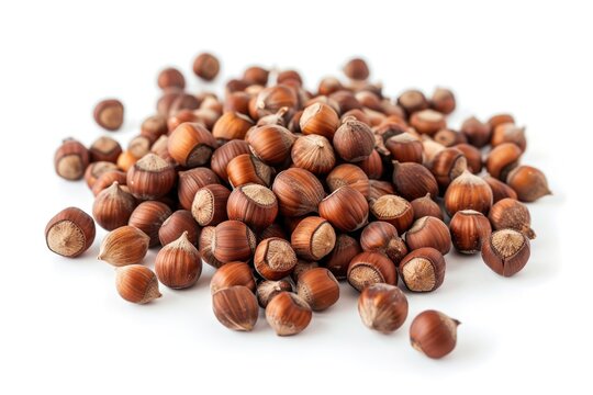 A heap of nuts sits on a clean white surface, perfect for counting or displaying