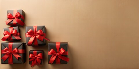 Fototapeta premium Black gift boxes with red ribbons are arranged on a beige background, creating a festive backdrop for black friday, christmas, or special occasions