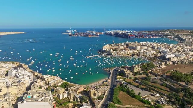 Drone top view of port, city, boats on the see. Freeport, road. Maltese island