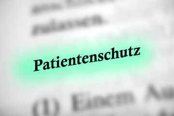 Obraz premium Patientenschutz - Deutsches Text Wort mit blauer Markierung