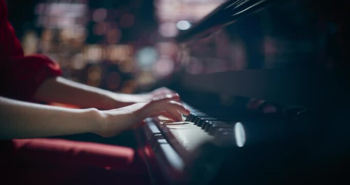 Close Up on Pianist Hands Playing an Exciting Jazz Melody on a Black Grand Piano. Anonymous Artist is Focused on Creating Beautiful Instrumental Song as She Practicing Playing on a Keyboard