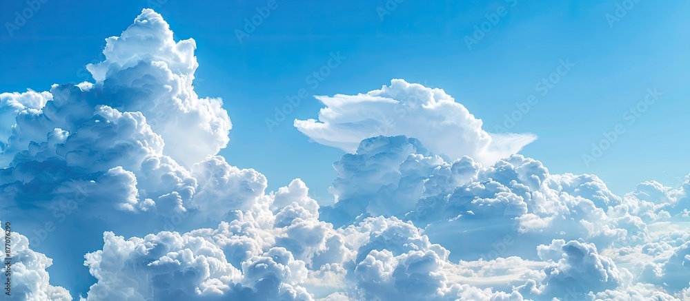 Poster scenic sky with fluffy clouds in a clear blue sky, ideal for a copy space image.