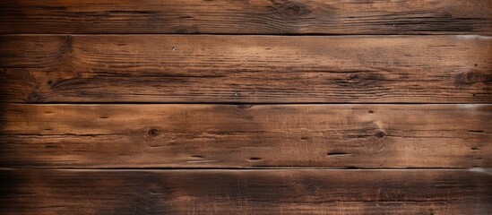 Obraz premium A weathered, brown wooden texture creating a rustic wood background with copy space image.