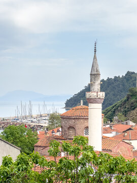 Streets and houses of Tirilye village, Historical old church in Trilye, view of the church converted into a mosque