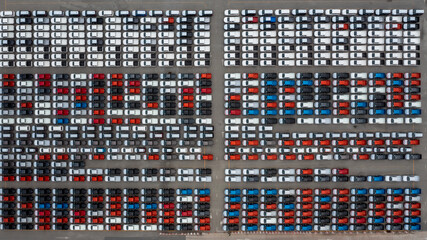 Aerial view of new car stock at distribution center automobile factory, Row of new car for sale in...