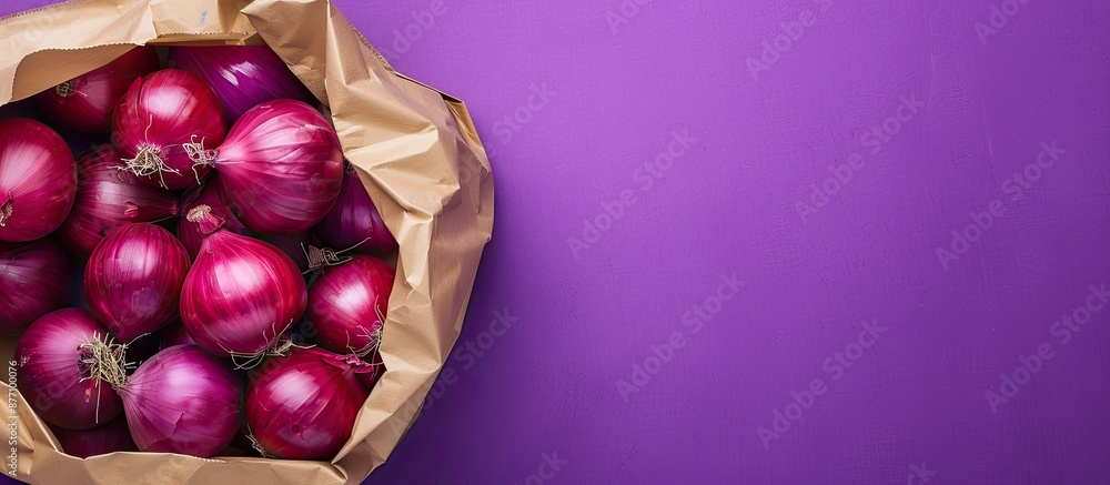 Aufkleber close up of red onions in a paper bag on a purple background with copy space image.