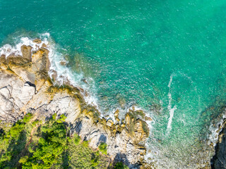 Amazing seascape view seashore and waves crashing on rocks,Aerial view beautiful sea in Phuket island Thailand