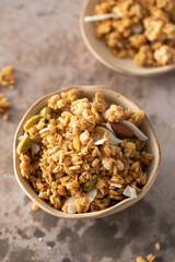 Crispy homemade granola with sliced almonds in a bowl. Healthy food