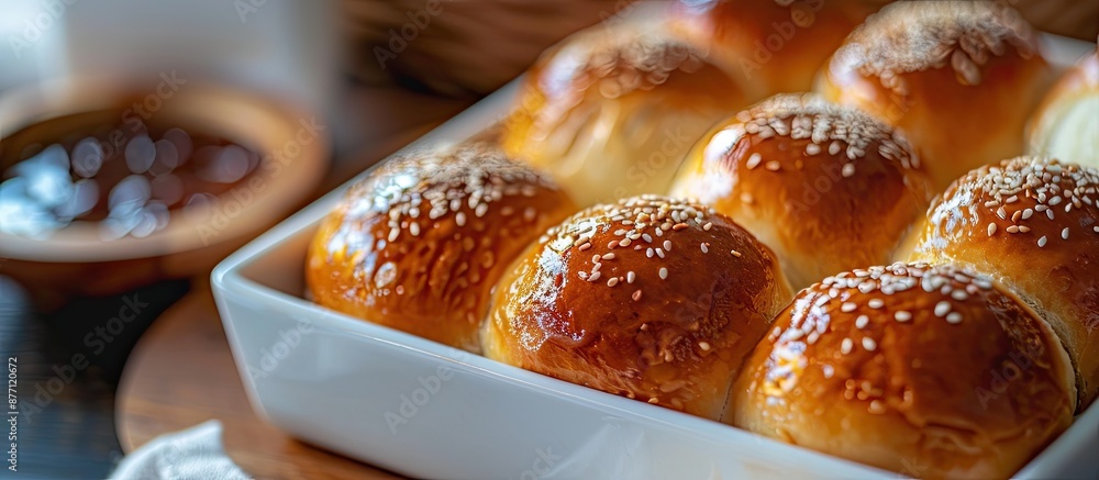 Fototapete cheese buns with various fillings like dulce de leche and guava jam, neatly arranged in a white cont